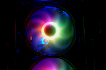 Computer cooler with RGB LED light. Computer circuit board and CPU cooling fans illuminated