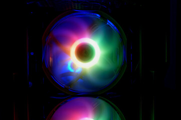 Colorful bright rainbow led rgb pc fan air case cooler. Computer chassis. Gaming modding, technology concept and IT background.