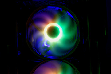 Computer cooler with RGB LED light. Computer circuit board and CPU cooling fans illuminated