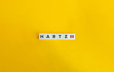 Hartz III (three) Banner. Letter Tiles on Yellow Background. Minimal Aesthetics.