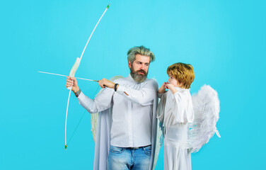 Valentines angels. Little cupid boy and father in angelic wings with bow and arrow. Arrows of love.