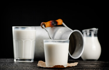 Fresh country milk in a glass on the table. 