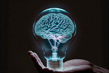 Hand holding a Lightning human brain inside a light bulb. Brainstorming concept