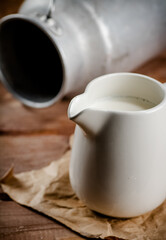 A jug of fresh milk on the table. 