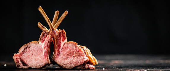 A delicious rack of grilled lamb on the table. 