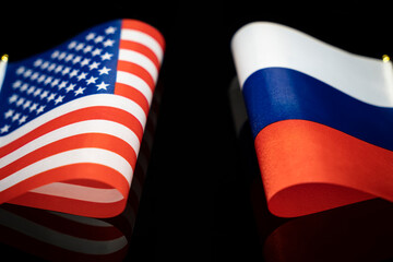 flags of the USA and russia on a black background.. The concept of interaction or counteraction...