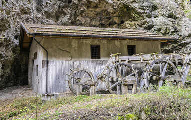 old mill along the Rio Sass di Fondo canyon in Non Valley, Trentino Alto Adige: a scenic excursion among narrow rock walls and fascinating light effects - Fondo, northern Italy .