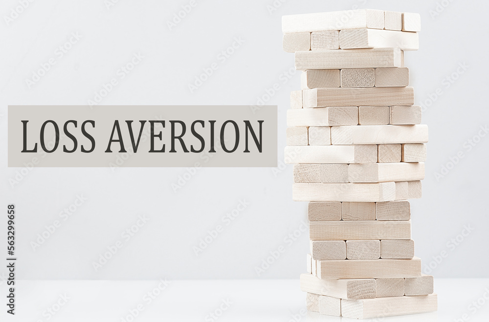 Poster loss aversion text with wooden block stack on white background , business concept