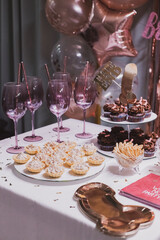 Bachelorette party table with sweets and decorations