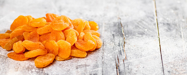 A pile of delicious dried apricots on the table. 