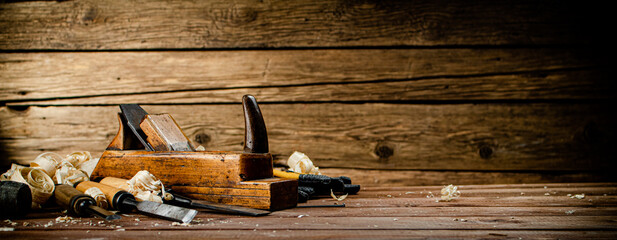 Hand planer with wooden sawdust. 