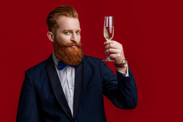 photo of tuxedo man sommelier cheering and celebrate. tuxedo man cheering and celebrate
