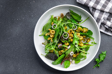 olive salad green mix lettuce leaves vegetable dish healthy meal food snack on the table copy space food background rustic top view keto or paleo diet veggie vegan or vegetarian food