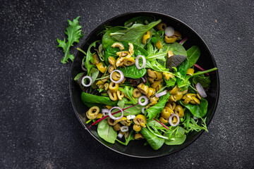 olive salad green mix lettuce leaves vegetable dish healthy meal food snack on the table copy space food background rustic top view keto or paleo diet veggie vegan or vegetarian food