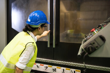 Factory female worker  check cnc milling automate robot machine