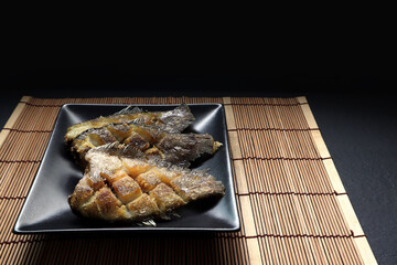 Thai crispy gourami fish , gouramy or Sepat Siam fish or Pla salid in Thai language displayed on...