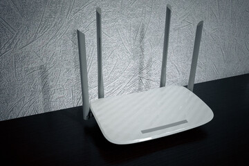 White router on a wooden table. Internet connection concept. Router with four antennas