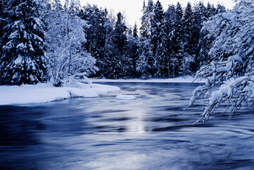 Frosty morning in a wintry river landscape. Farnebofjarden national park in north of Sweden.