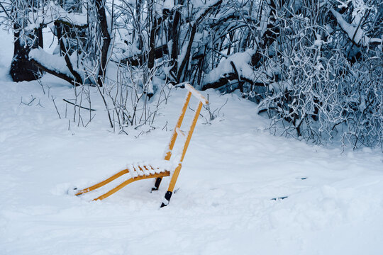 a parked kicksled in the snow