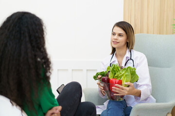 Female woman having a consulting with a professional doctor or nutritionist about eating and nutrition. 