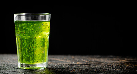 A glass of fresh kiwi juice. 