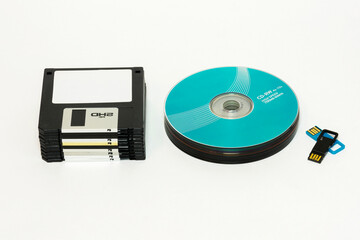 Floppy disks, CD / DVD disk and USB flash on a white background