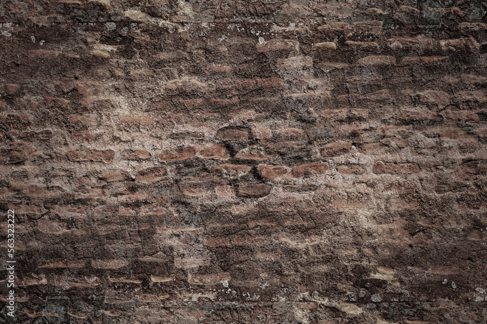 Wall mural Dark brick structural ancient wall with destroyed stucco