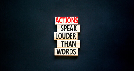 Actions speak louder words symbol. Concept words Actions speak louder than words on wooden blocks. Beautiful black table black background. Business new mindset for results concept. Copy space.