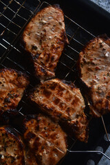 Pieces of fried pork meat. Barbecue. Delicious fried pork loin. Chunks of meat in close-up. Meat on coals.