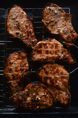 Pieces of fried pork meat. Barbecue. Delicious fried pork loin. Chunks of meat in close-up. Meat on coals.