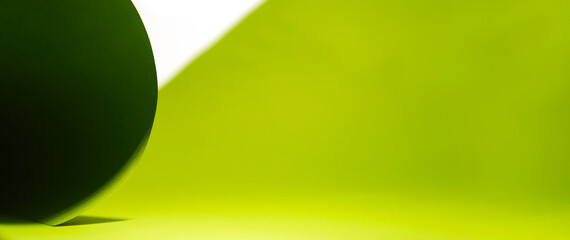 green wave from paper on white background with copy space. Top view. Close-up image. Concepts: lines and geometry.