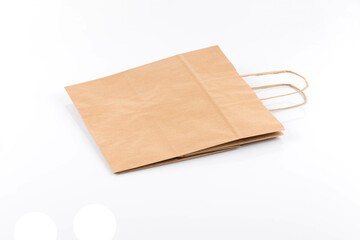 Paper shopping bag on white