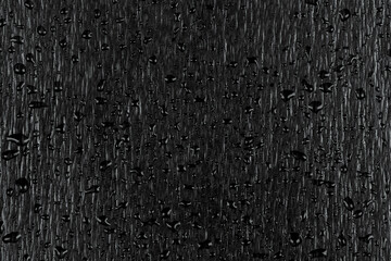 Water drops on dark stone