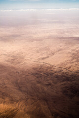 Fototapeta na wymiar Aerial view of south landscape in Tunisia during the flight Monastir to Tozeur- Tunis