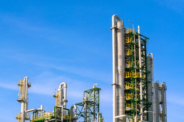 oil and gas tank distillation reactor column in chemical refinery industry petrochemical business to pipeline and storage tank for transportation network ecosystem energy concept