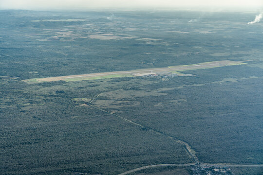 Varadero, Cuba,  aerial view of Runway, Taxiway and airport building of Juan Gualberto G&oacute;mez Airport (Varadero Airport) during a sunny day. Bird eyes view