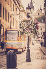 Lviv tram in the historical center of the city, summer, vintage photo processing, tourism