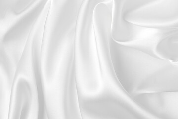 Abstract white fabric texture background. Cloth soft wave. Creases of satin, silk, and cotton.