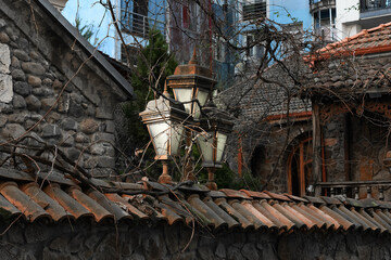 Old electric lamp on stone wall