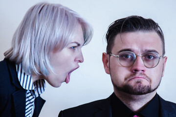 Portrait of angry strict executive, female ceo or team leader scolding employeer. Unprofessional behavior and team conflict concept. Horizontal image. - obrazy, fototapety, plakaty