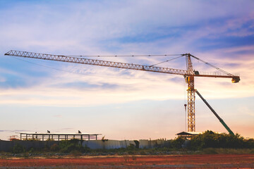 Fototapeta na wymiar tower crane at construction site preparing for buiding city . tower crane with evening sunset.