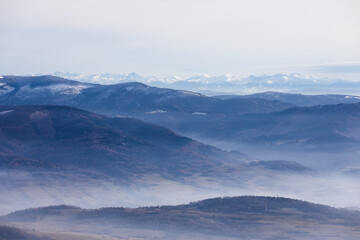Misty mountains landscape in winter in Poland