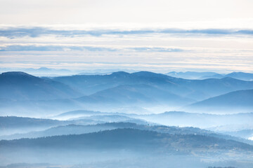 Fototapeta na wymiar Beautiful landscape with layers of hills in the fog