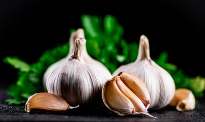 Fragrant garlic with parsley on the table. 