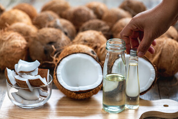 Virgin coconut oil liquid by cold pressed with HDL by Raw coconut milk in glass bottle.