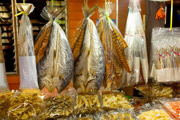 Dried fish and seafood on the market in Thailand. Delicious delicacies of sea fishing.