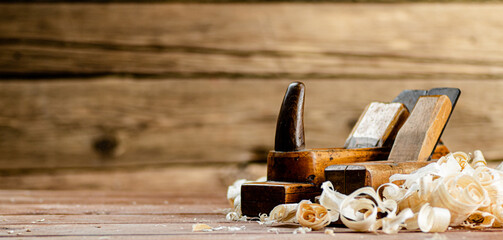Working tool. Planer with wooden shavings. 