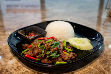 Rice topped with stir-fried Beef and basil,Thai food.