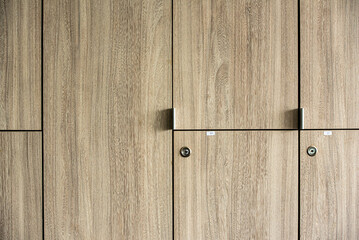 Naklejka premium Wooden lockers with key in locker room at school sport club office.