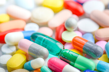 capsules tablets pill on white table. light shiny to blister pack of the capsules